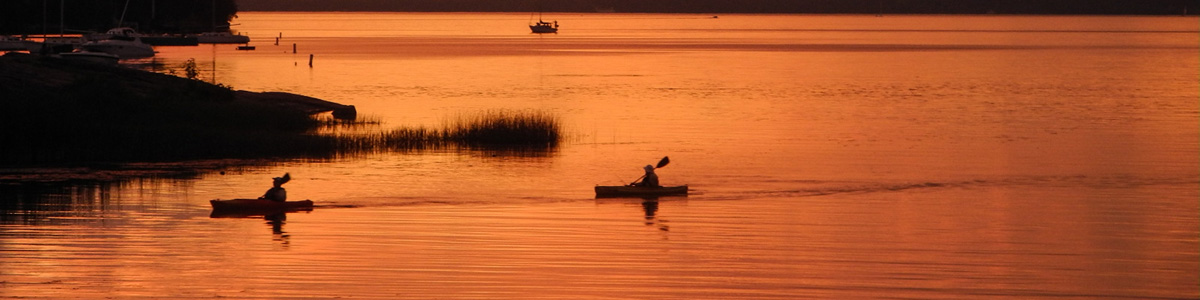 Paddlers at sunset on Lake Champlain